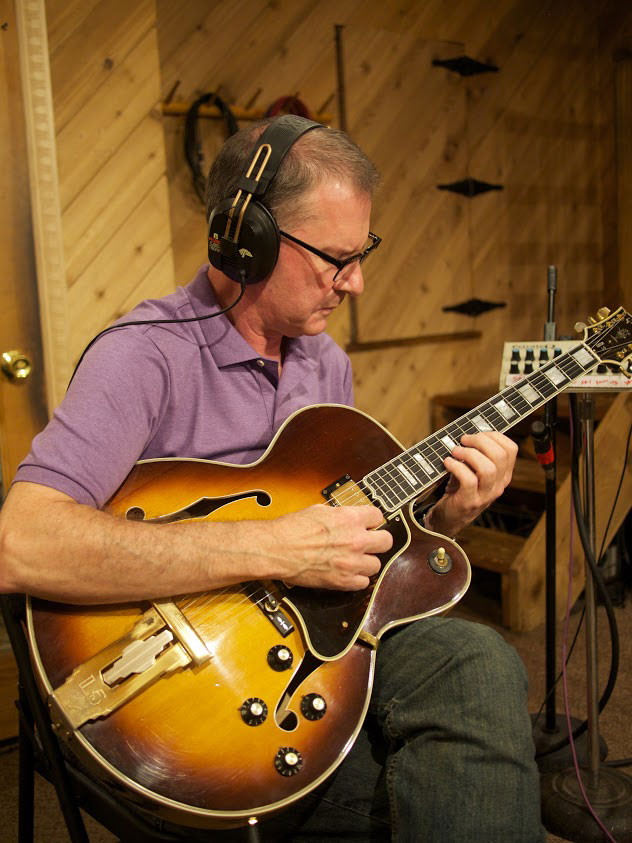 Photo by Ian Keller.  For any interested guitar buffs, I had the pickguard and pickup covers replaced due to extreme deterioration from 'outgassing.'